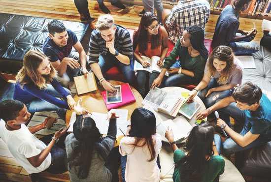 A group of college students studying together in the library