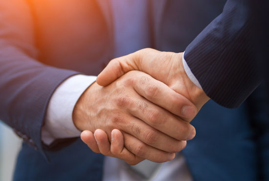 Two business men shaking hands